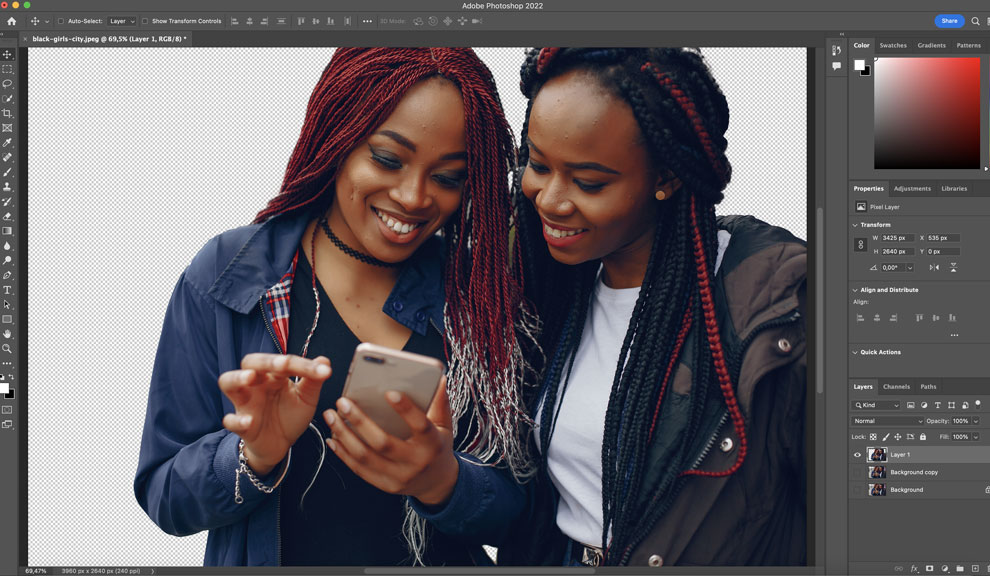 Screenshot of the Photoshop artboard with an image of two ladies looking into a phone.